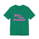Kelly green pickleball t-shirt with a pink script Let's Play Pickleball text design
