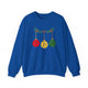 Royal blue crewneck sweatshirt with pickleballs styled as Christmas ornaments hanging from a holly branch
