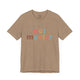 Heather tan t-shirt with retro Net Master text design and sparkle accents