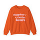 Orange pickleball sweatshirt with retro script text "Happiest On the Court" and sparkle accents