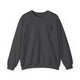 Dark Heather pickleball sweatshirt with a small silhouette of a person swinging a pickleball paddle on the chest