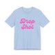 Baby blue pickleball t-shirt with a pink script Drop Shot text design