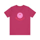 Berry pickleball t-shirt with a pink smiley face graphic over "Pickleball" text