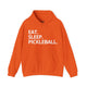 Orange hoodie with Eat. Sleep. Pickleball. text design