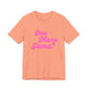 Sunset orange pickleball t-shirt with a pink script One More Game text design