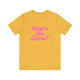 Heather yellow gold pickleball t-shirt with a pink script What's the Score text design
