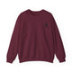 Pickleball sweatshirt with a small silhouette of a person swinging a pickleball paddle on the chest