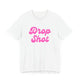 White pickleball t-shirt with a pink script Drop Shot text design
