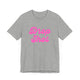 Athletic heather pickleball t-shirt with a pink script Drop Shot text design