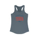 Solid Indigo pickleball racerback tank top with a distressed collegiate-style "Bainbridge Island 1965 WA" text stack in navy and coral
