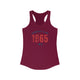 Solid Cardinal Red pickleball racerback tank top with a distressed collegiate-style "Bainbridge Island 1965 WA" text stack in navy and coral