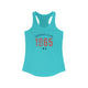 Solid Tahiti Blue pickleball racerback tank top with a distressed collegiate-style "Bainbridge Island 1965 WA" text stack in navy and coral