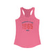 Solid Hot Pink pickleball racerback tank top with a distressed collegiate-style "Bainbridge Island 1965 WA" text stack in navy and coral