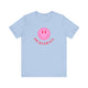 Baby Blue pickleball t-shirt with a pink smiley face graphic over "Pickleball" text