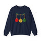Navy crewneck sweatshirt with pickleballs styled as Christmas ornaments hanging from a holly branch