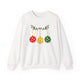 White crewneck sweatshirt with pickleballs styled as Christmas ornaments hanging from a holly branch