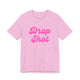 Heather bubble gum pickleball t-shirt with a pink script Drop Shot text design