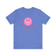 Heather Columbia Blue pickleball t-shirt with a pink smiley face graphic over "Pickleball" text