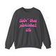 Dark heather pickleball crewneck sweatshirt with a pink script Livin' That Pickleball Life text design