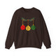Dark chocolate crewneck sweatshirt with pickleballs styled as Christmas ornaments hanging from a holly branch