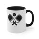 White mug with a Black accent and a minimalist icon of two crossed pickleball paddles and a ball