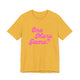 Heather yellow gold pickleball t-shirt with a pink script One More Game text design