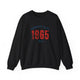 Black pickleball crewneck sweatshirt with a distressed collegiate-style "Bainbridge Island 1965 WA" text stack in navy and coral