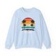 Light Blue pickleball crewneck sweatshirt with a retro sunset circle with silhouetted palm trees and "West Coast Pickleball" script text