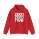 Red hoodie with a stacked ZERO ZERO TWO text design and a pickleball replacing the O in two