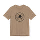 Heather Tan pickleball t-shirt with a circular Pickleball Bainbridge Island badge logo