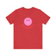 Heather Red pickleball t-shirt with a pink smiley face graphic over "Pickleball" text