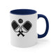 White mug with a Navy accent and a minimalist icon of two crossed pickleball paddles and a ball