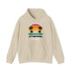 Sand pickleball hoodie with a retro sunset circle with silhouetted palm trees and "West Coast Pickleball" script text
