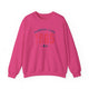 Heliconia pickleball crewneck sweatshirt with a distressed collegiate-style "Bainbridge Island 1965 WA" text stack in navy and coral