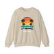 Sand pickleball crewneck sweatshirt with a retro sunset circle with silhouetted palm trees and "West Coast Pickleball" script text