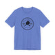 Heather Columbia Blue pickleball t-shirt with a circular Pickleball Bainbridge Island badge logo