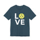 Deep teal t-shirt with a LOVE text design and a yellow pickleball replacing the O