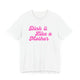 White pickleball t-shirt with a pink script Dink it Like a Mother text design