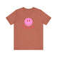 Heather Clay pickleball t-shirt with a pink smiley face graphic over "Pickleball" text
