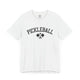 White t-shirt with an arched PICKLEBALL text design over crossed paddles