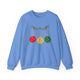 Carolina blue crewneck sweatshirt with pickleballs styled as Christmas ornaments hanging from a holly branch