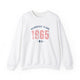 White pickleball crewneck sweatshirt with a distressed collegiate-style "Bainbridge Island 1965 WA" text stack in navy and coral