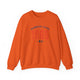 Orange pickleball crewneck sweatshirt with a distressed collegiate-style "Bainbridge Island 1965 WA" text stack in navy and coral