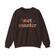 Dark chocolate sweatshirt with retro Net Master text design and sparkle accents