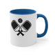 White mug with a Blue accent and a minimalist icon of two crossed pickleball paddles and a ball