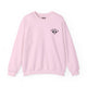 Light pink crewneck sweatshirt with a small PICKLEBALLER chest logo featuring crossed paddles