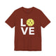 Rust t-shirt with a LOVE text design and a yellow pickleball replacing the O