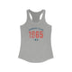 Heather Grey pickleball racerback tank top with a distressed collegiate-style "Bainbridge Island 1965 WA" text stack in navy and coral