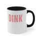 White mug with a Black accent and a bold "DINK" wordmark